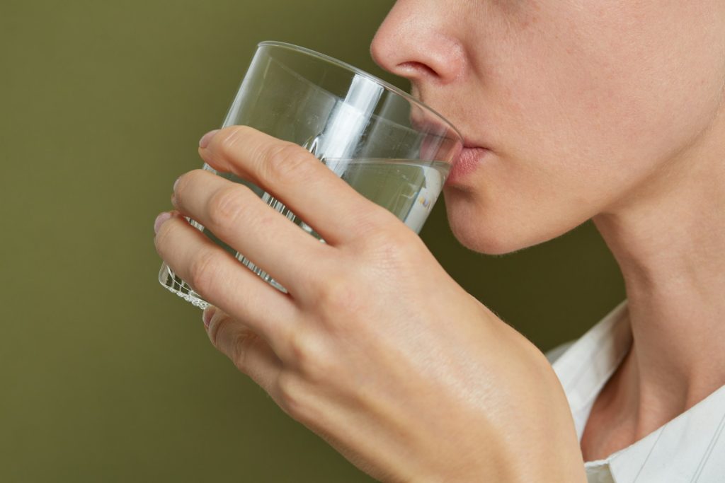 woman drinking water, avoiding Dehydration